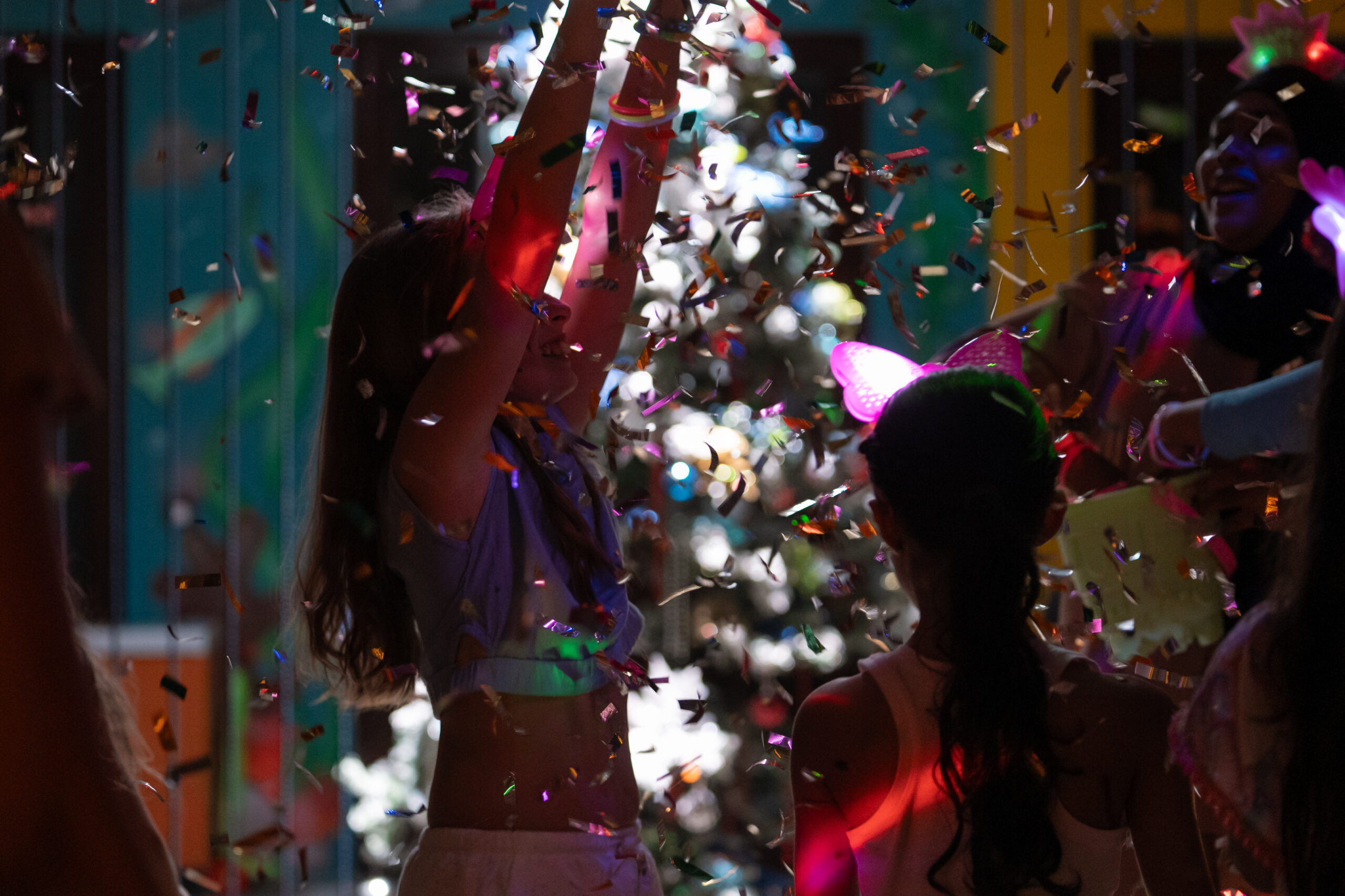 Festive in Maldives Dancing in Christmas Beach Party with confetti
