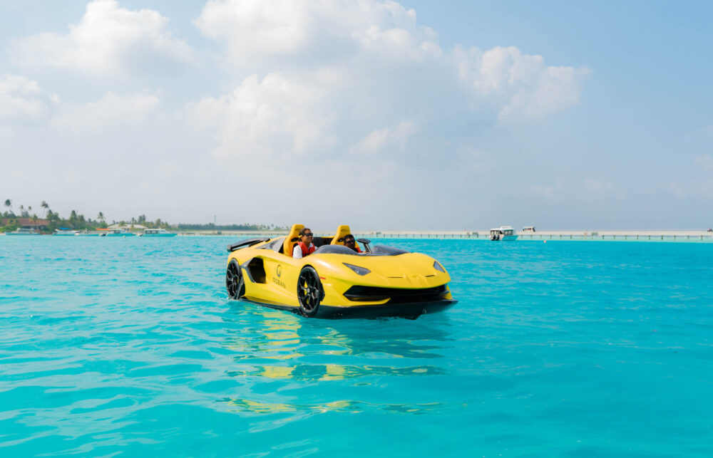 Couple riding a yellow jetcar on the lagoon
