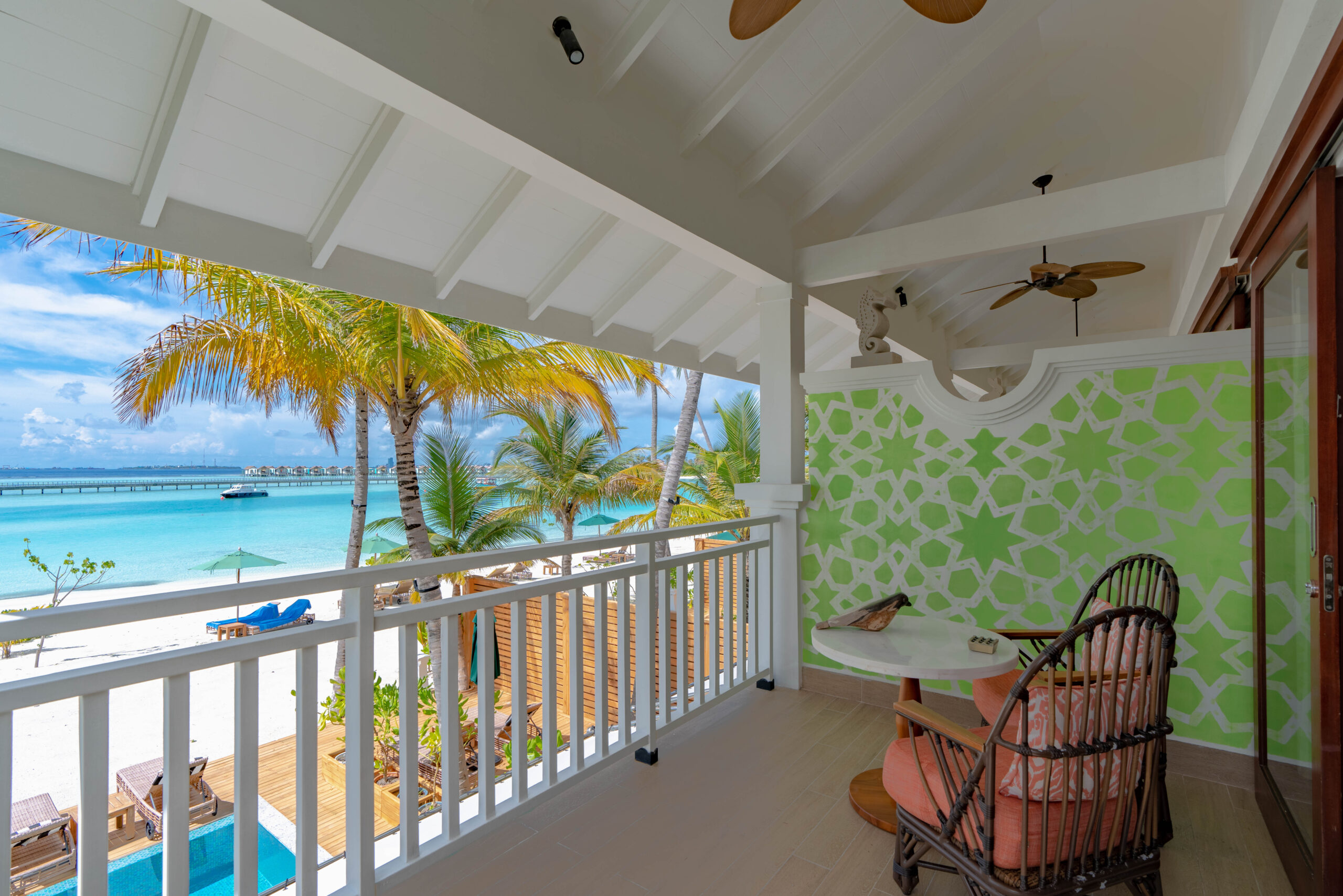 Sky room balcony view with chairs and table